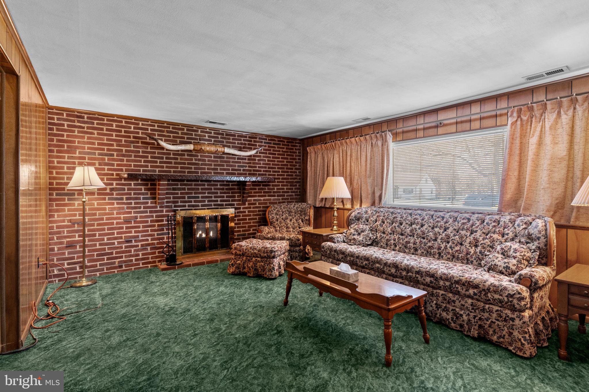 857 West County Line Road Warminster, PA 18974 - Photo 13 of 38 a living room with furniture and a fireplace
