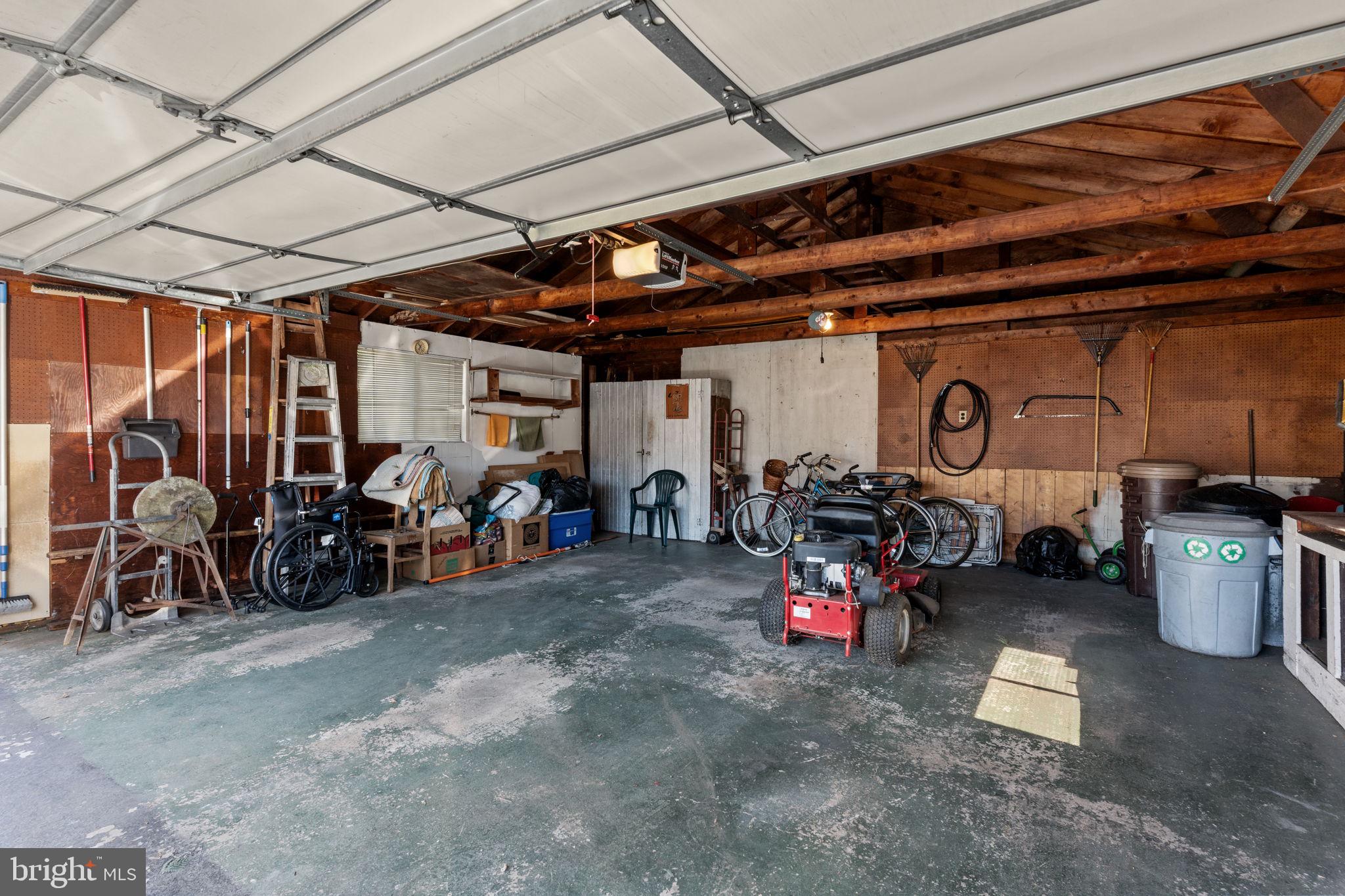 857 West County Line Road Warminster, PA 18974 - Photo 32 of 38 a view of a garage with a bike and car
