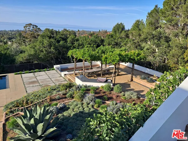a view of a backyard with sitting area