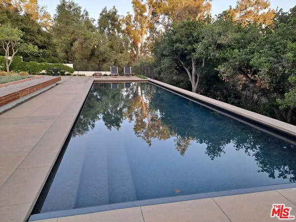 a view of swimming pool from a balcony