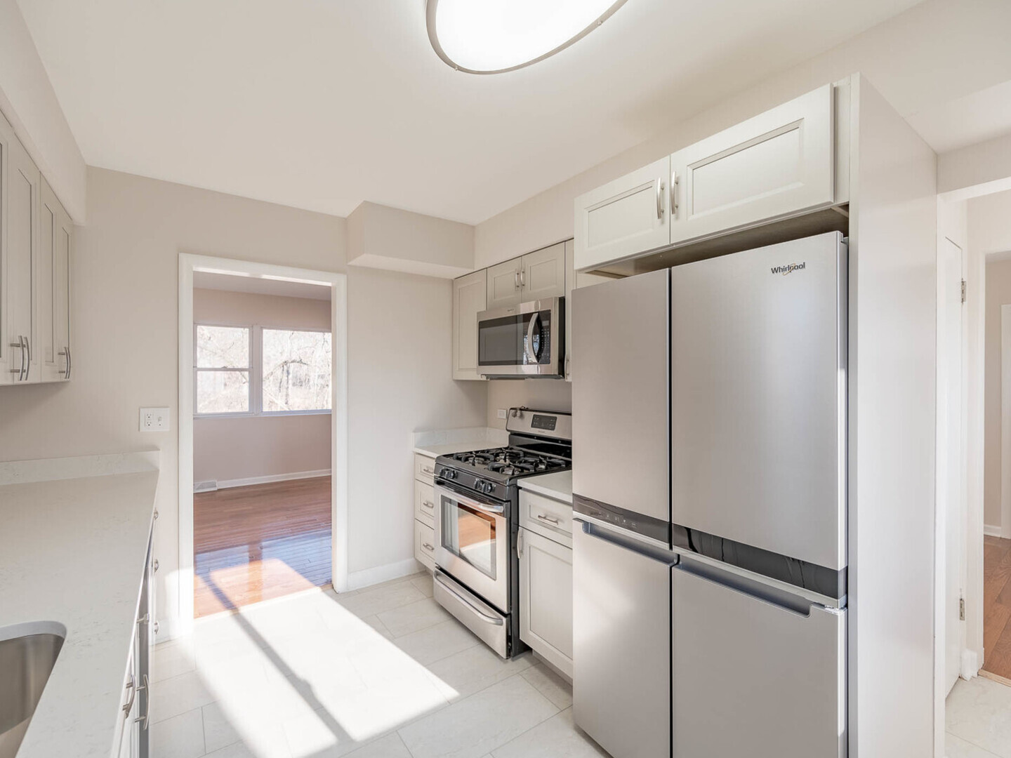 191 Juneway Terrace Lake Bluff, IL 60044 - Photo 4 of 11 a kitchen with stainless steel appliances a refrigerator sink and cabinets