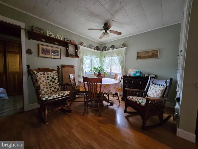 a city room with lots of stuff and flowers