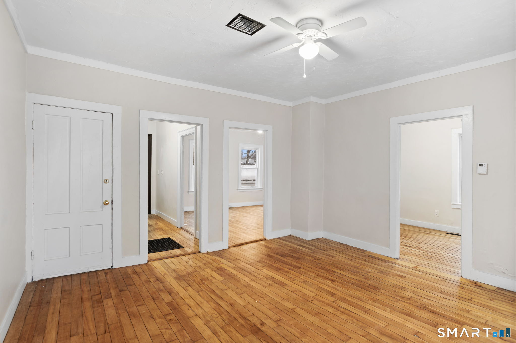 365-367 Putnam Road Plainfield, CT 06387 - Photo 11 of 40 a bedroom with a bed and a chandelier