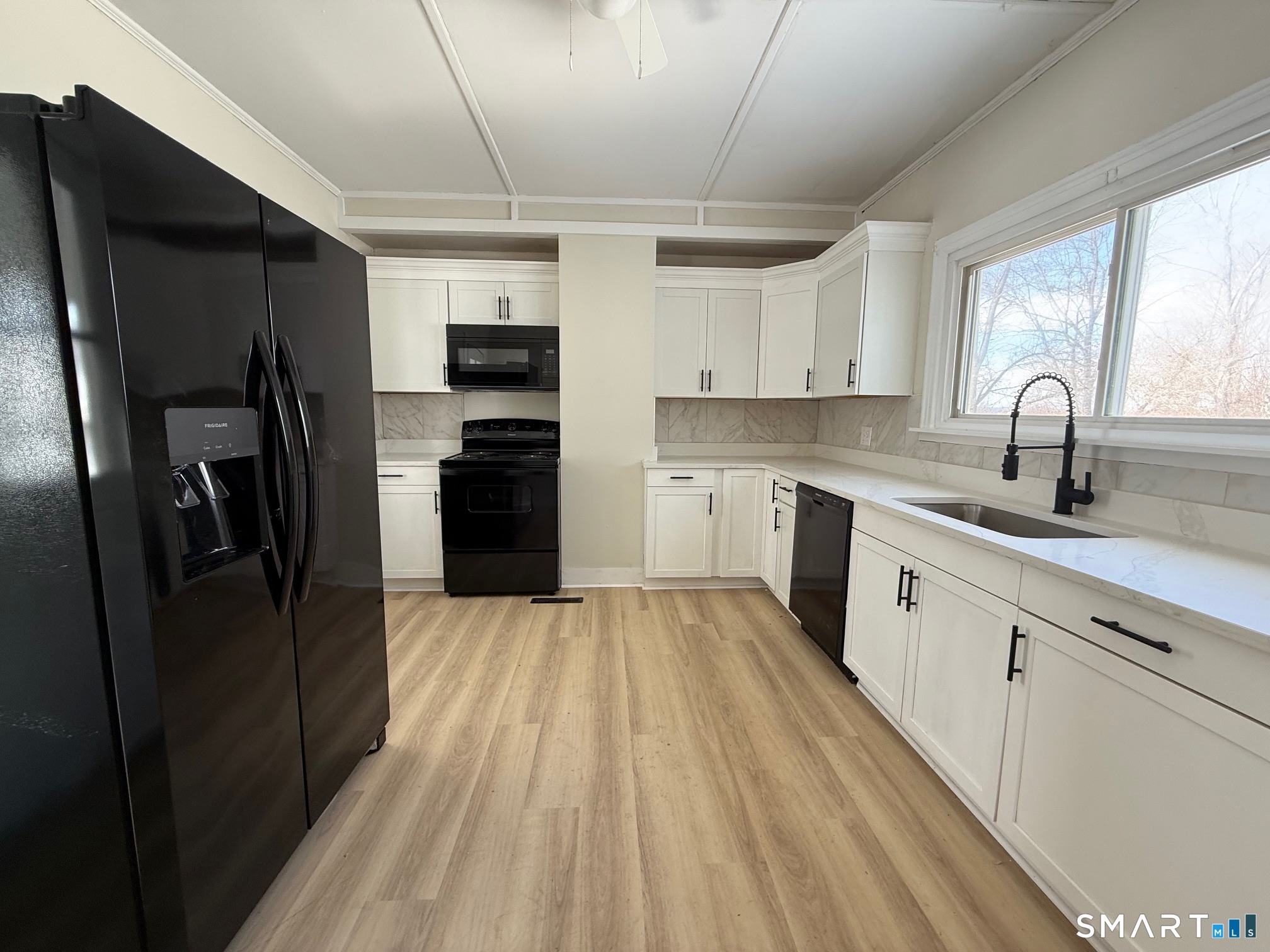 365-367 Putnam Road Plainfield, CT 06387 - Photo 13 of 40 a kitchen with stainless steel appliances a refrigerator sink and cabinets