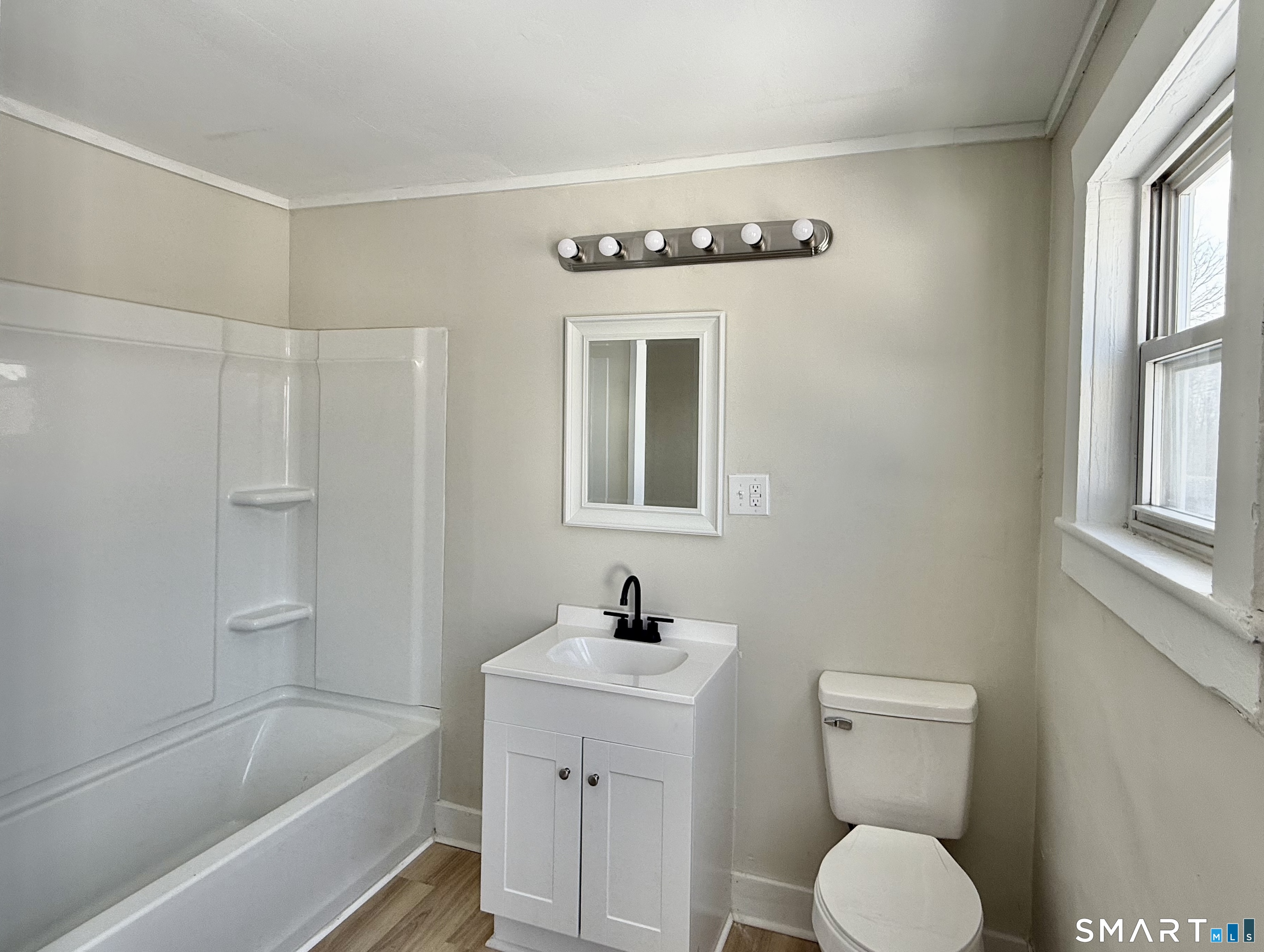 365-367 Putnam Road Plainfield, CT 06387 - Photo 16 of 40 a bathroom with a sink a toilet and shower