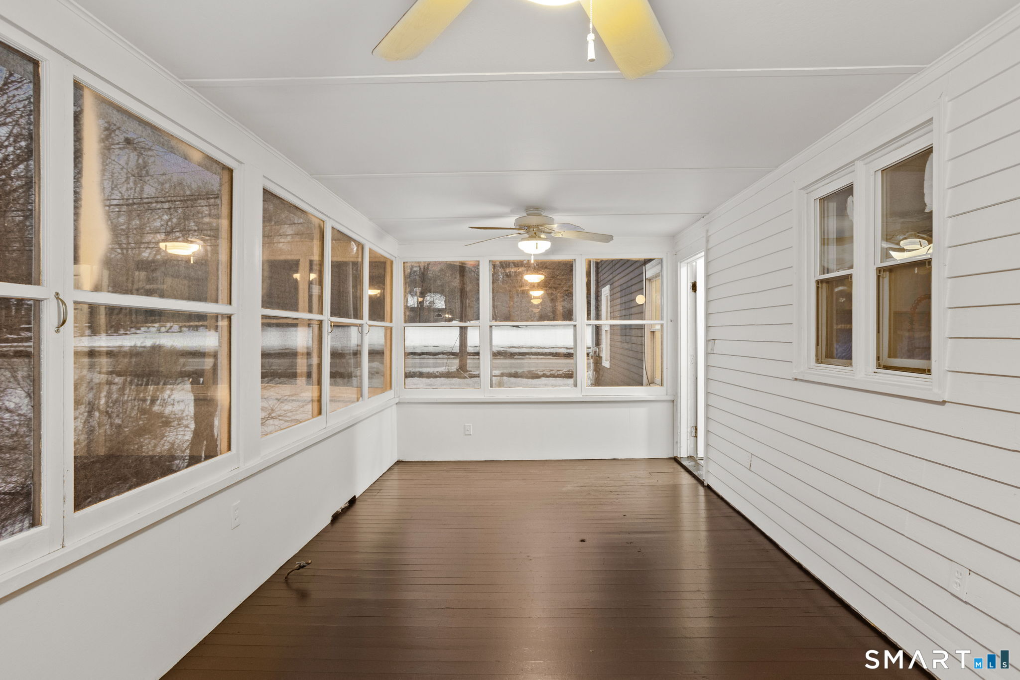 365-367 Putnam Road Plainfield, CT 06387 - Photo 19 of 40 a view of an empty room with wooden floor and a window