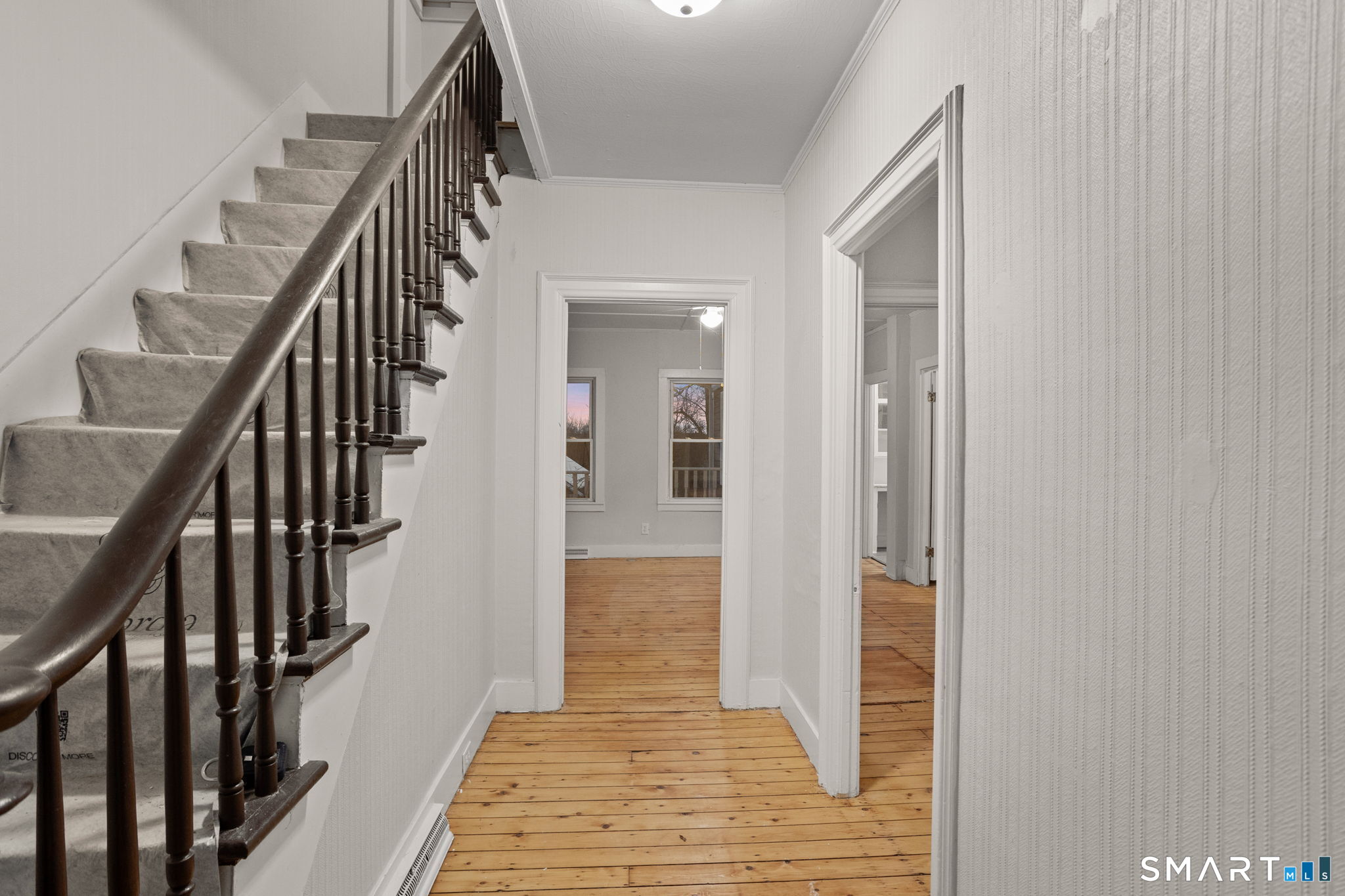 365-367 Putnam Road Plainfield, CT 06387 - Photo 21 of 40 a view of hallway with wooden floor and stairs