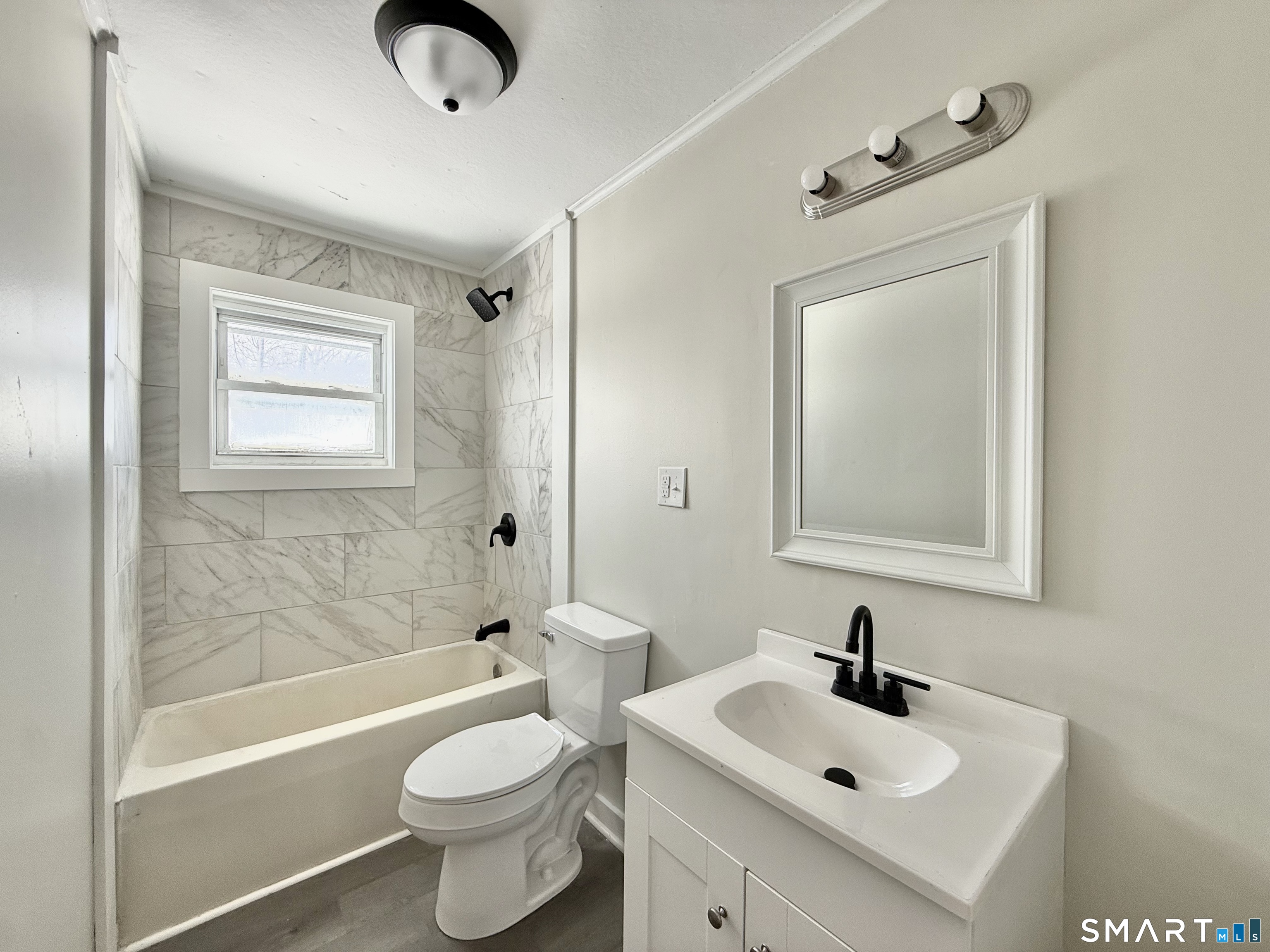 365-367 Putnam Road Plainfield, CT 06387 - Photo 31 of 40 a bathroom with a sink a toilet and shower