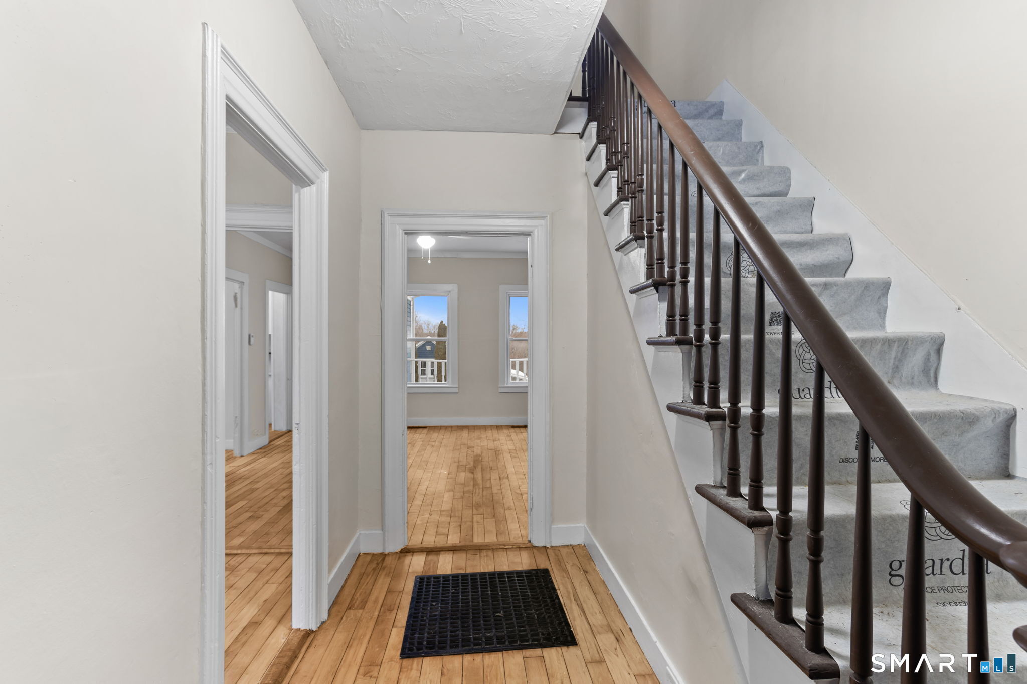 365-367 Putnam Road Plainfield, CT 06387 - Photo 7 of 40 a view of a hallway view with wooden floor and staircase