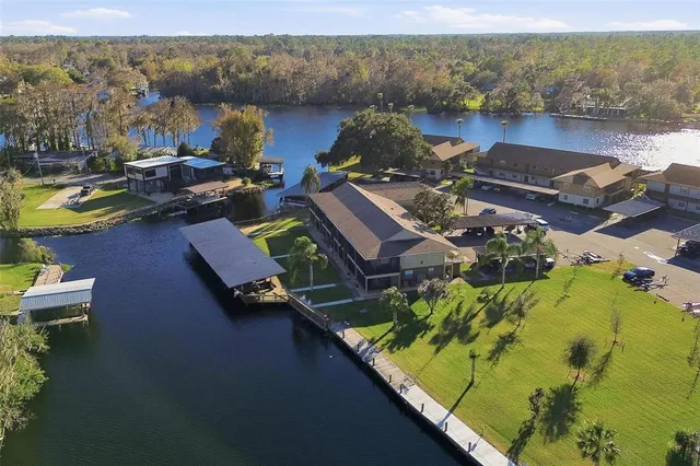 an aerial view of a house with a lake view