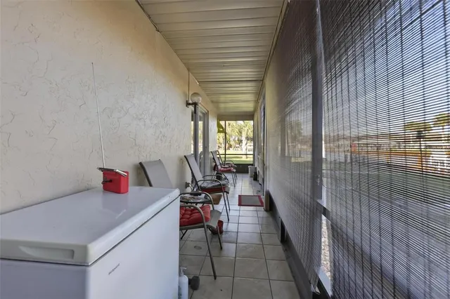 a hallway with a view of living room with furniture