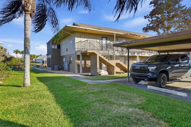 a view of a cars park in front of building