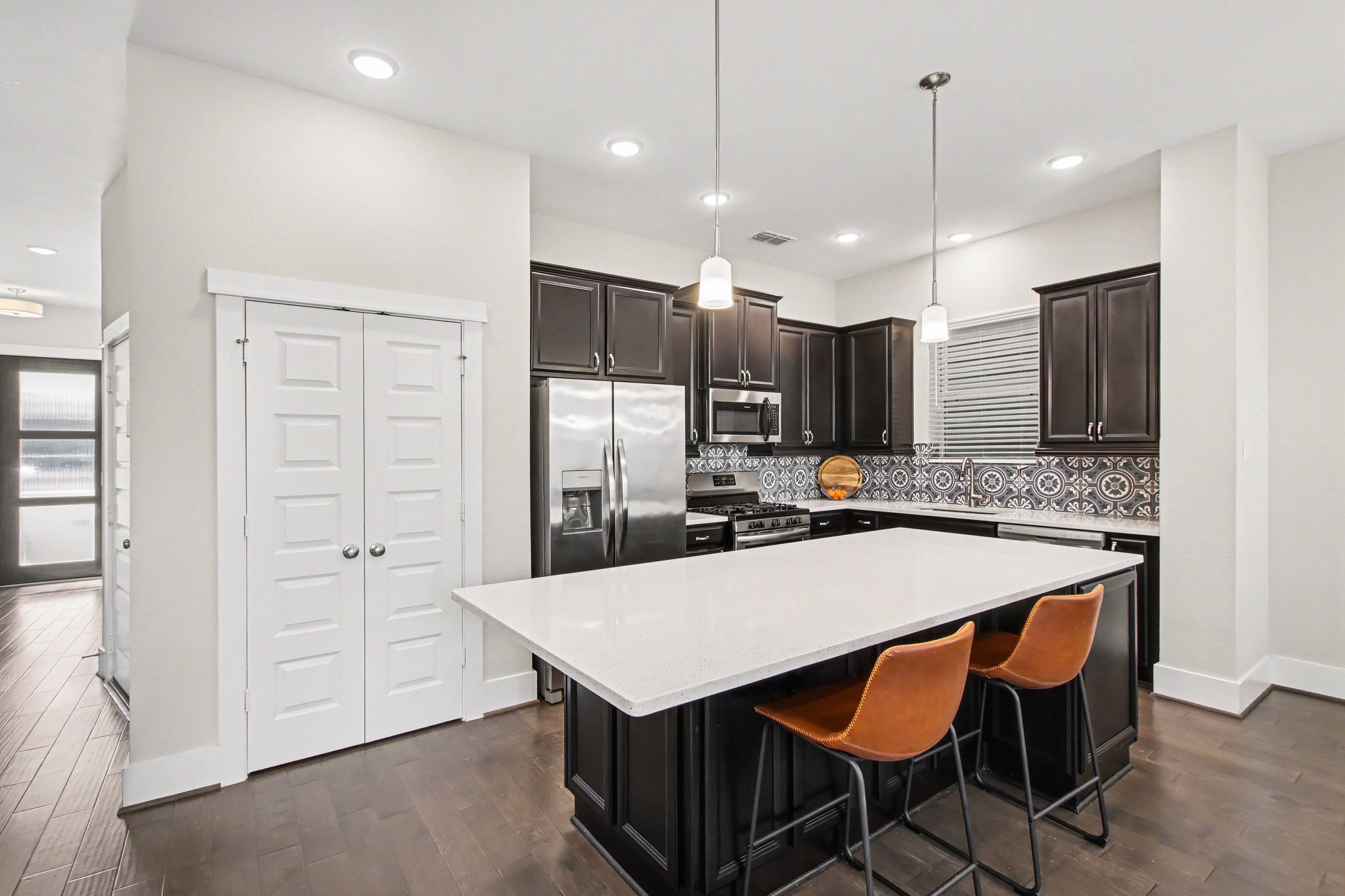 2007 Tarfite Place Houston, TX 77077 - Photo 7 of 24 a kitchen with a table chairs refrigerator and microwave
