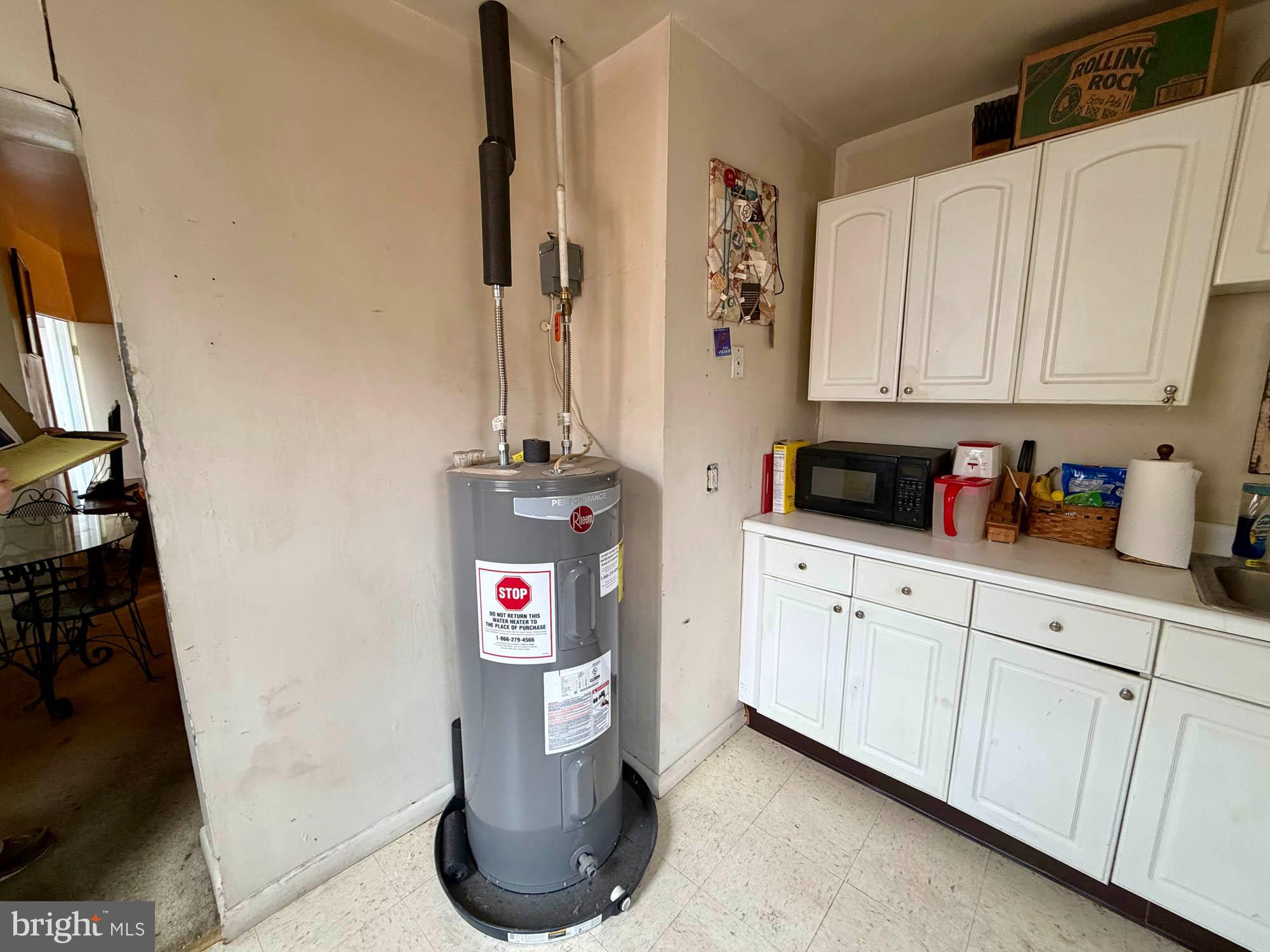 1135 Light Street Baltimore, MD 21230 - Photo 18 of 41 a kitchen with a sink and cabinets