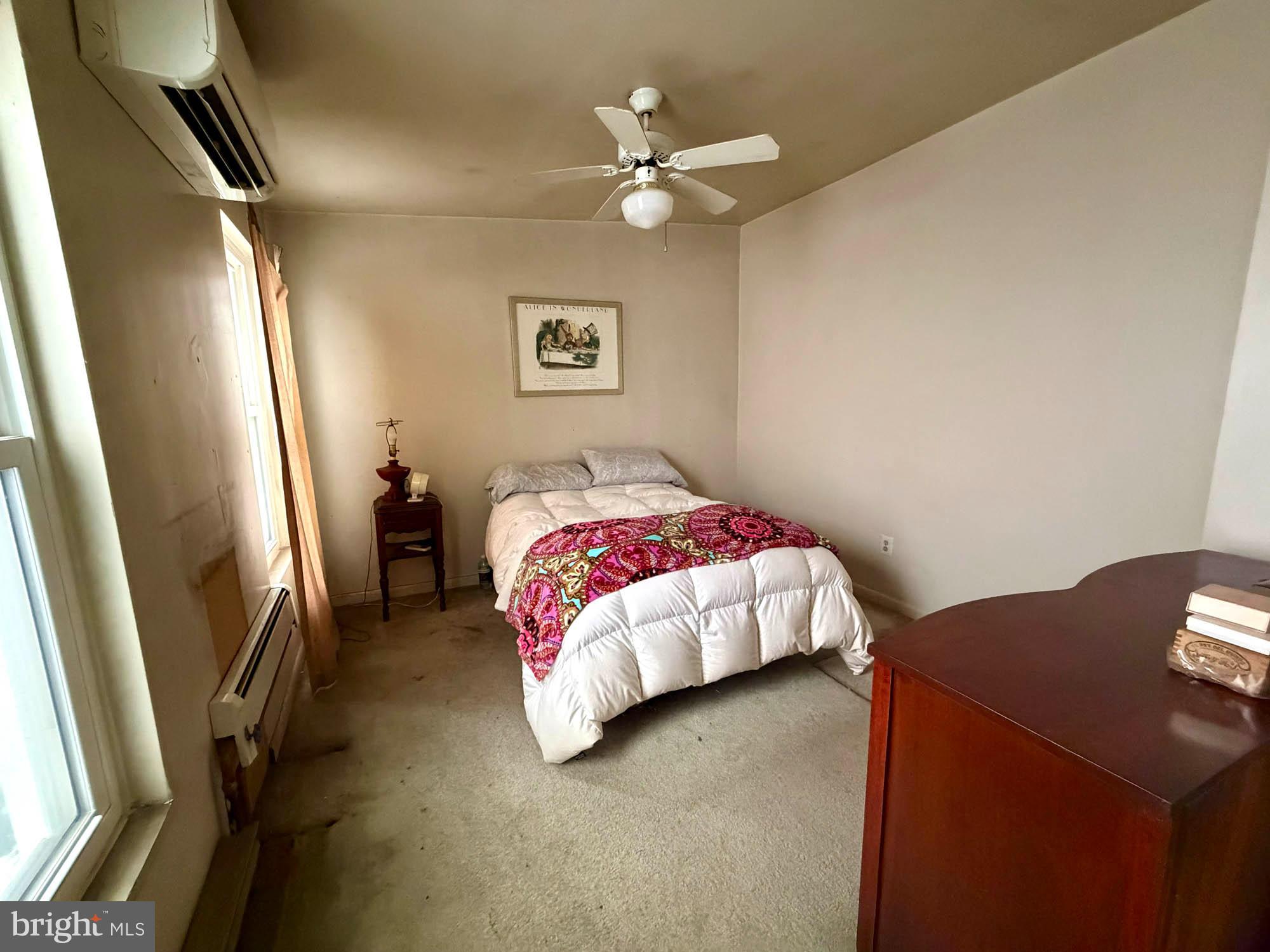 1135 Light Street Baltimore, MD 21230 - Photo 19 of 41 a bedroom with a bed and a chandelier