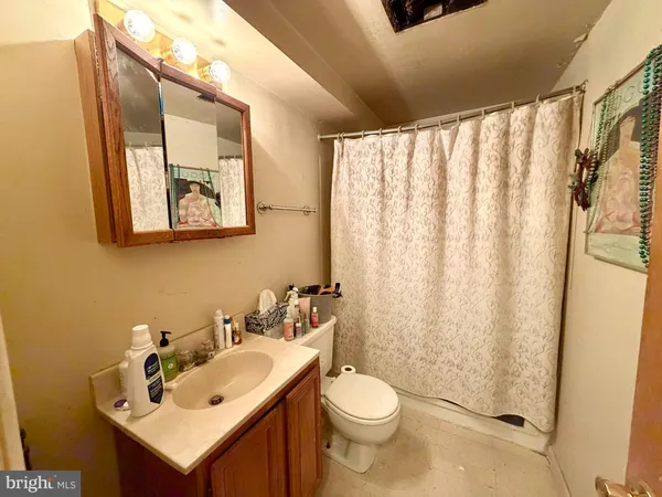 a kitchen with sink a refrigerator and cabinets