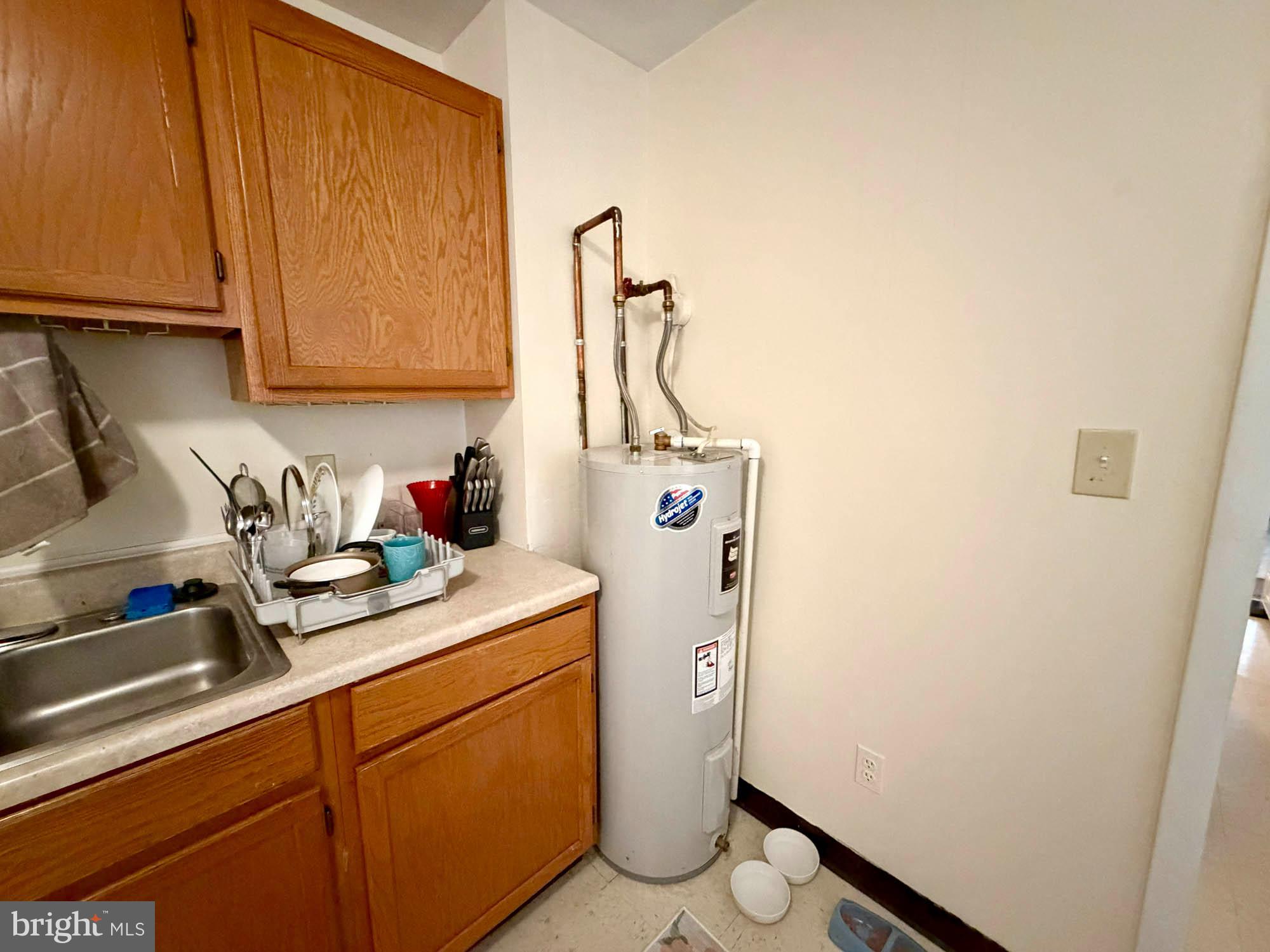 1135 Light Street Baltimore, MD 21230 - Photo 24 of 41 a utility room with sink dryer and washer