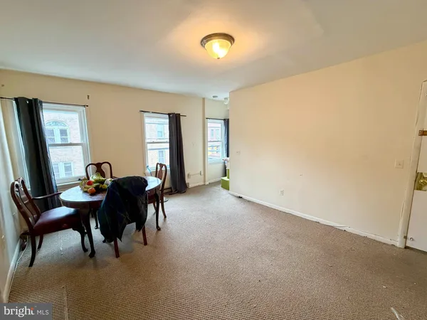 a bedroom with bed and a couch