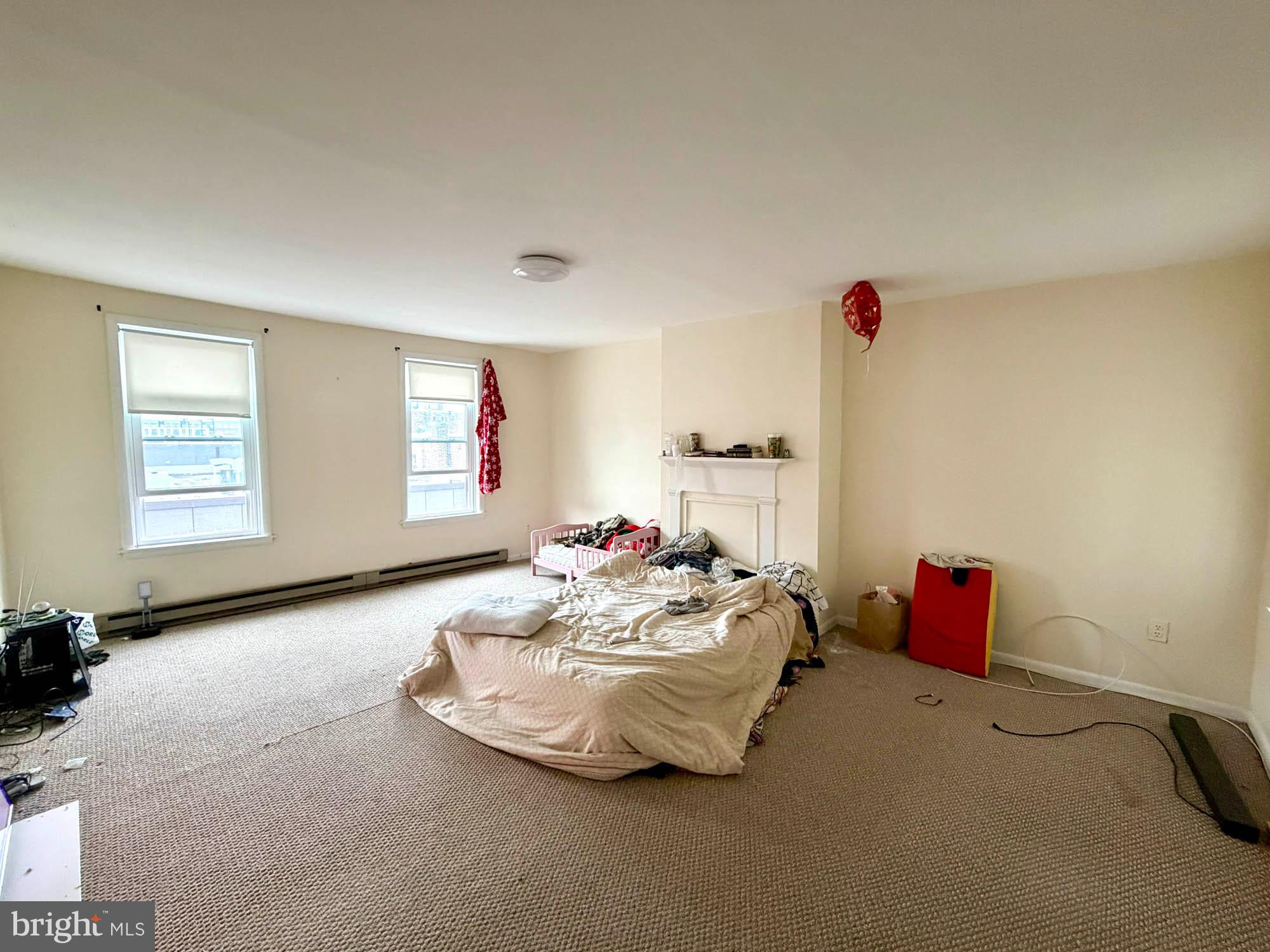 1135 Light Street Baltimore, MD 21230 - Photo 30 of 41 a bedroom with bed and a couch