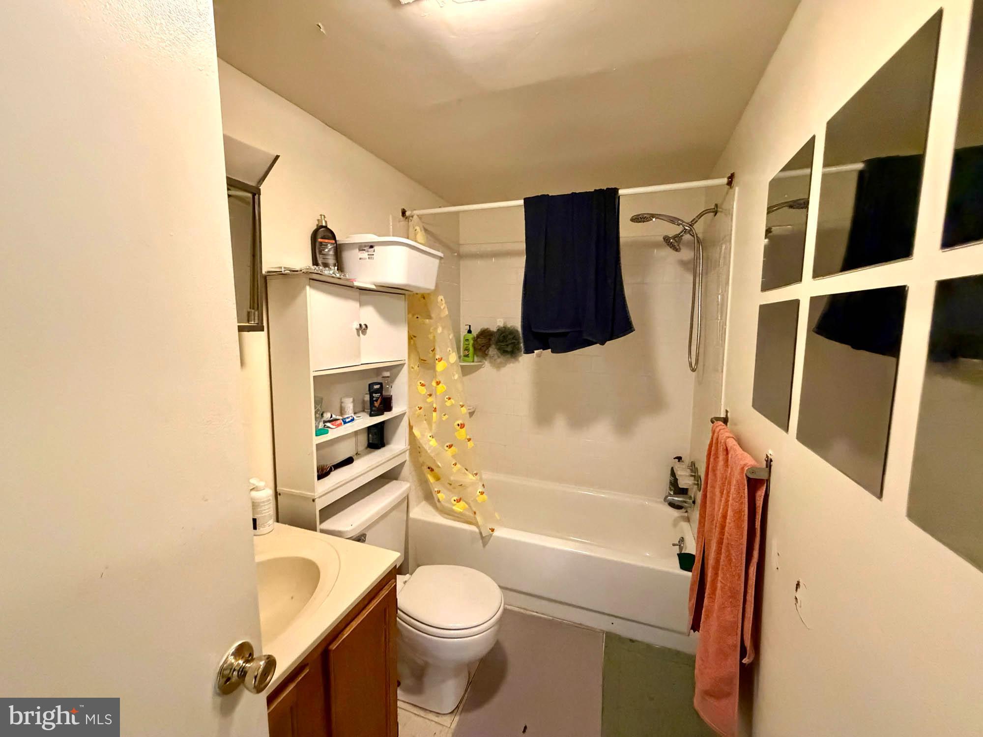 1135 Light Street Baltimore, MD 21230 - Photo 34 of 41 a bathroom with a toilet and a shower