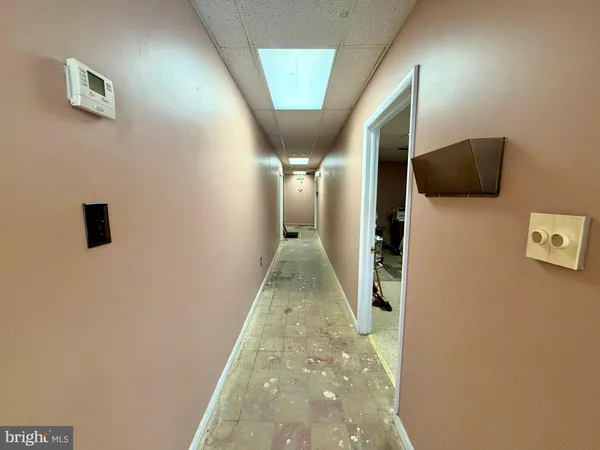 a view of a hallway with closet