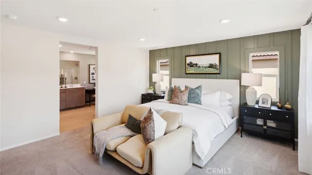 a bedroom with a bed and a couch