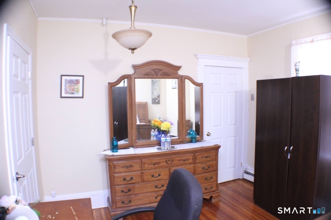 150 Whitney Street Hartford, CT 06105 - Photo 7 of 39 a view of dining room with wooden floor and cabinet