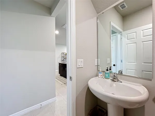 a living room with furniture and a chair