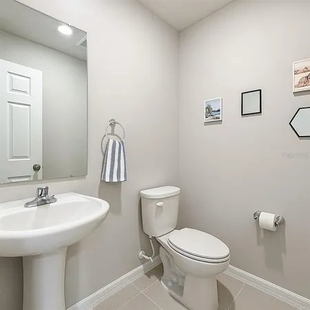 a spacious bedroom with a bed and a night stand