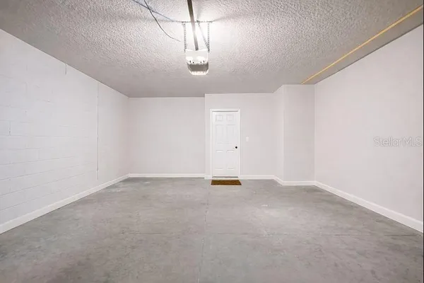a view of a house with backyard porch and sitting area