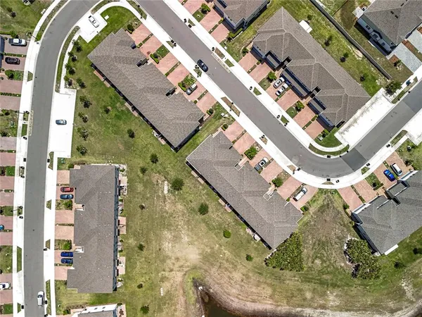 a view of a swimming pool and lounge chairs