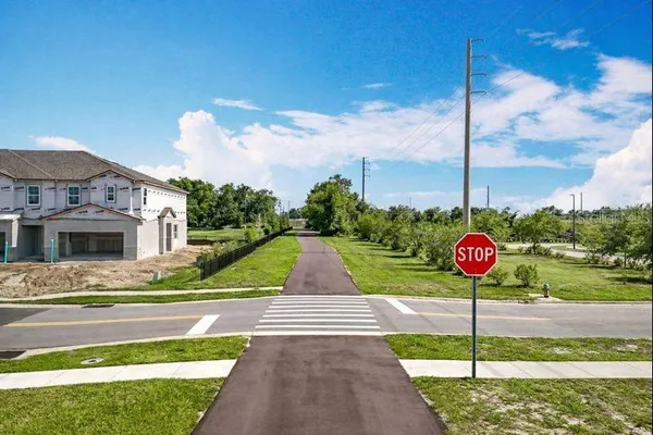 a view of a house with swimming pool and sitting area