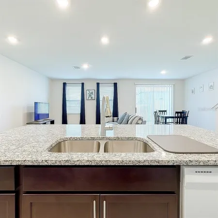 a stove top oven sitting inside of a kitchen