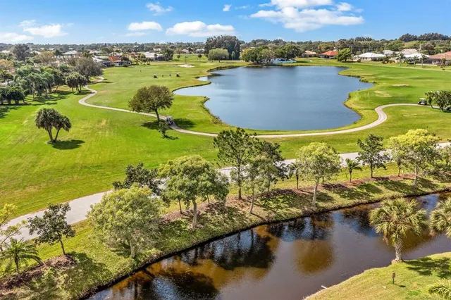 a view of a house with backyard porch and sitting area