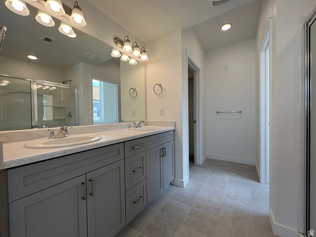 717 West W Coho Lane South, Unit 2F302 Midvale, UT 84047 - Photo 20 of 22 Dual vanity with light gray cabinetry and white countertops