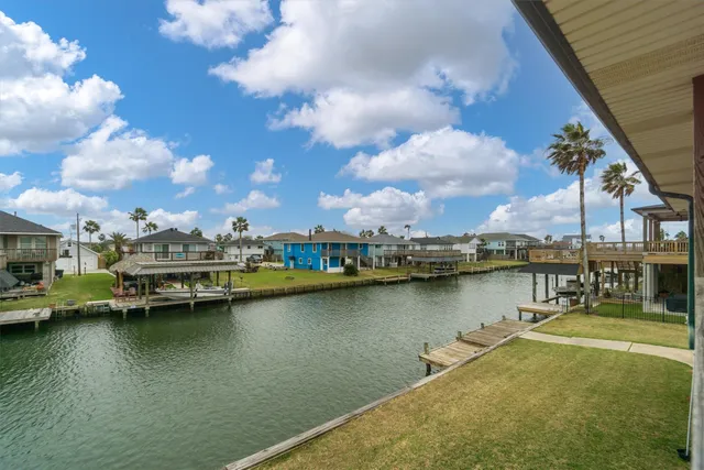 a view of a lake with boats and trees