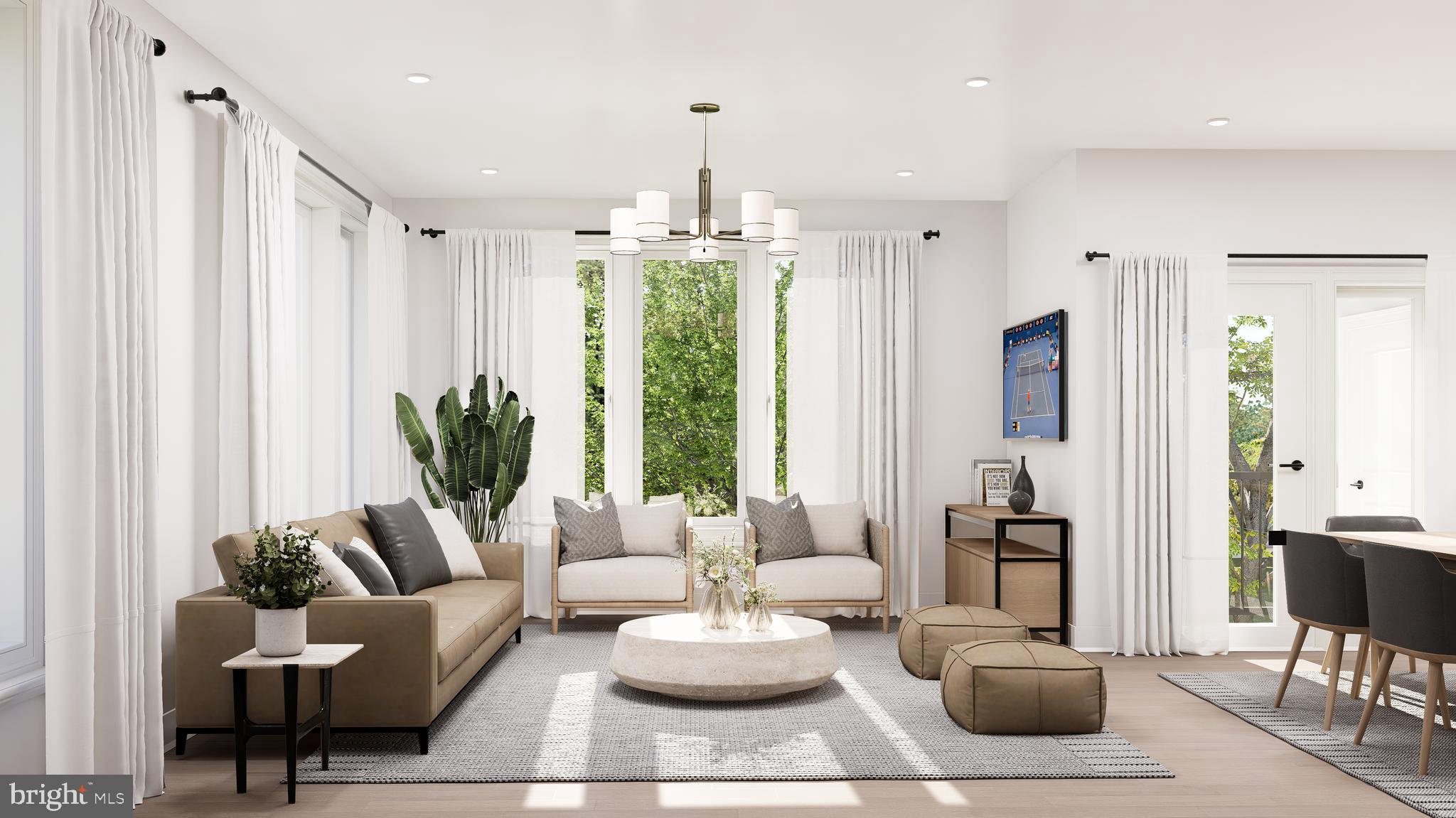 83 Bethlehem Pike, Unit 1102 Colmar, PA 18915 - Photo 4 of 16 a living room with furniture potted plant and a large window