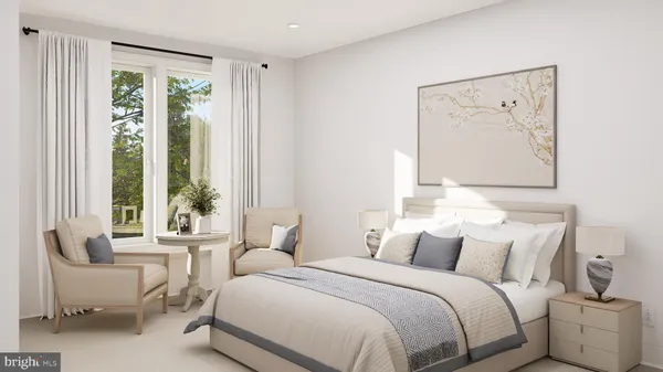 a bedroom with a large bed and a painting on the wall