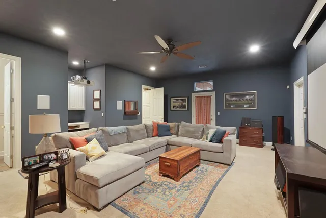 a spacious bedroom with a bed and a couch