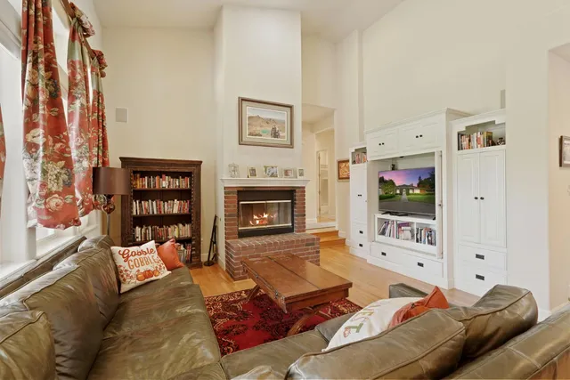 a bedroom with a large bed and a dresser