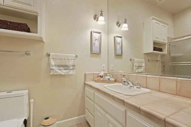 a backyard of a house with lots of green space and garden