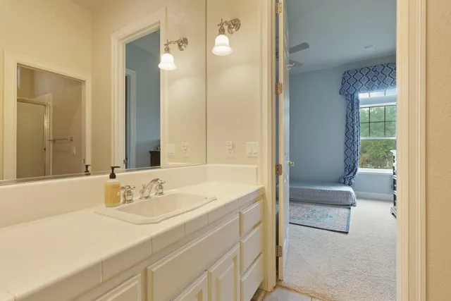 a view of a patio with couches table and chairs and potted plants