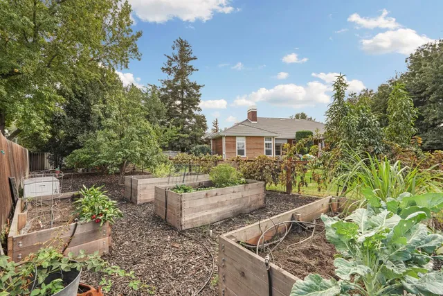 an aerial view of a house with yard swimming pool and outdoor seating