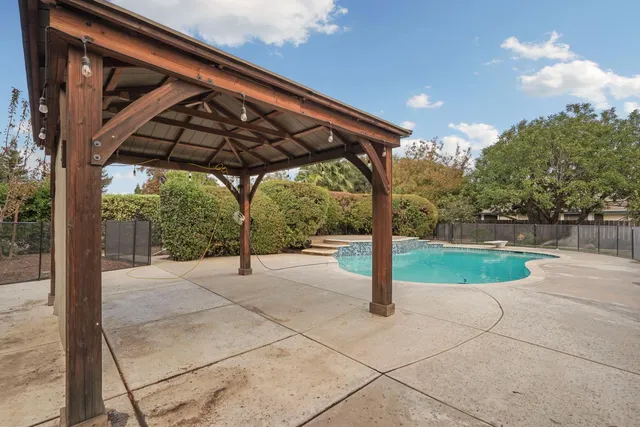 an aerial view of a house with garden space and outdoor space