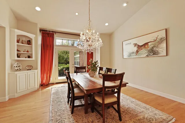 a stove top oven sitting inside of a kitchen