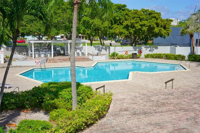 a view of a swimming pool with a patio