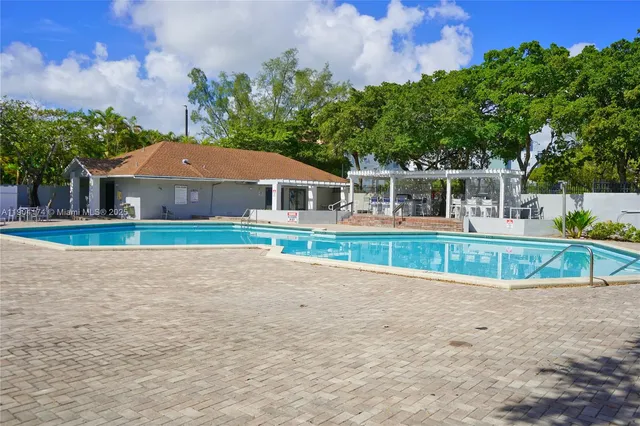a house with trees in the background