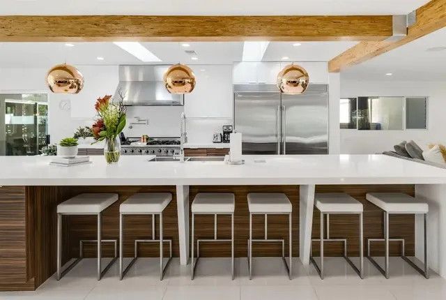 a kitchen with a sink and a stove