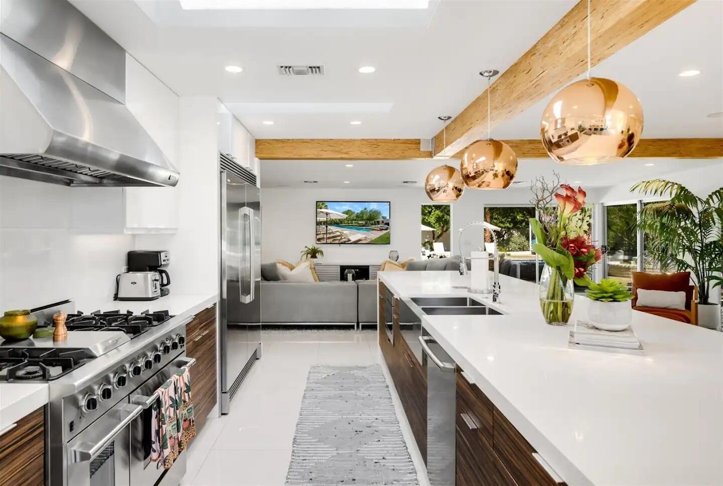72382 Desert Drive Rancho Mirage, CA 92270 - Photo 18 of 45 a kitchen with stainless steel appliances granite countertop a stove and a large cabinets