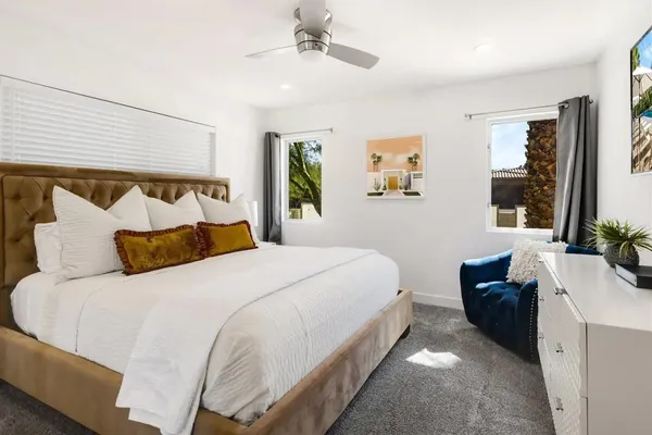 a bedroom with a bed and window